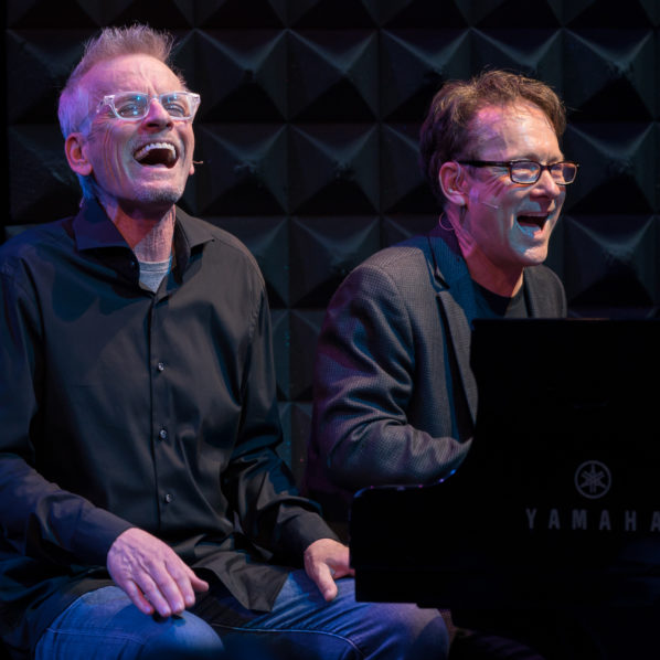 Rob Paulsen (Left) and Randy Rogel (Right) sitting down and laughing