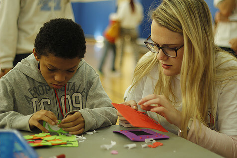 woman and boy making crafts