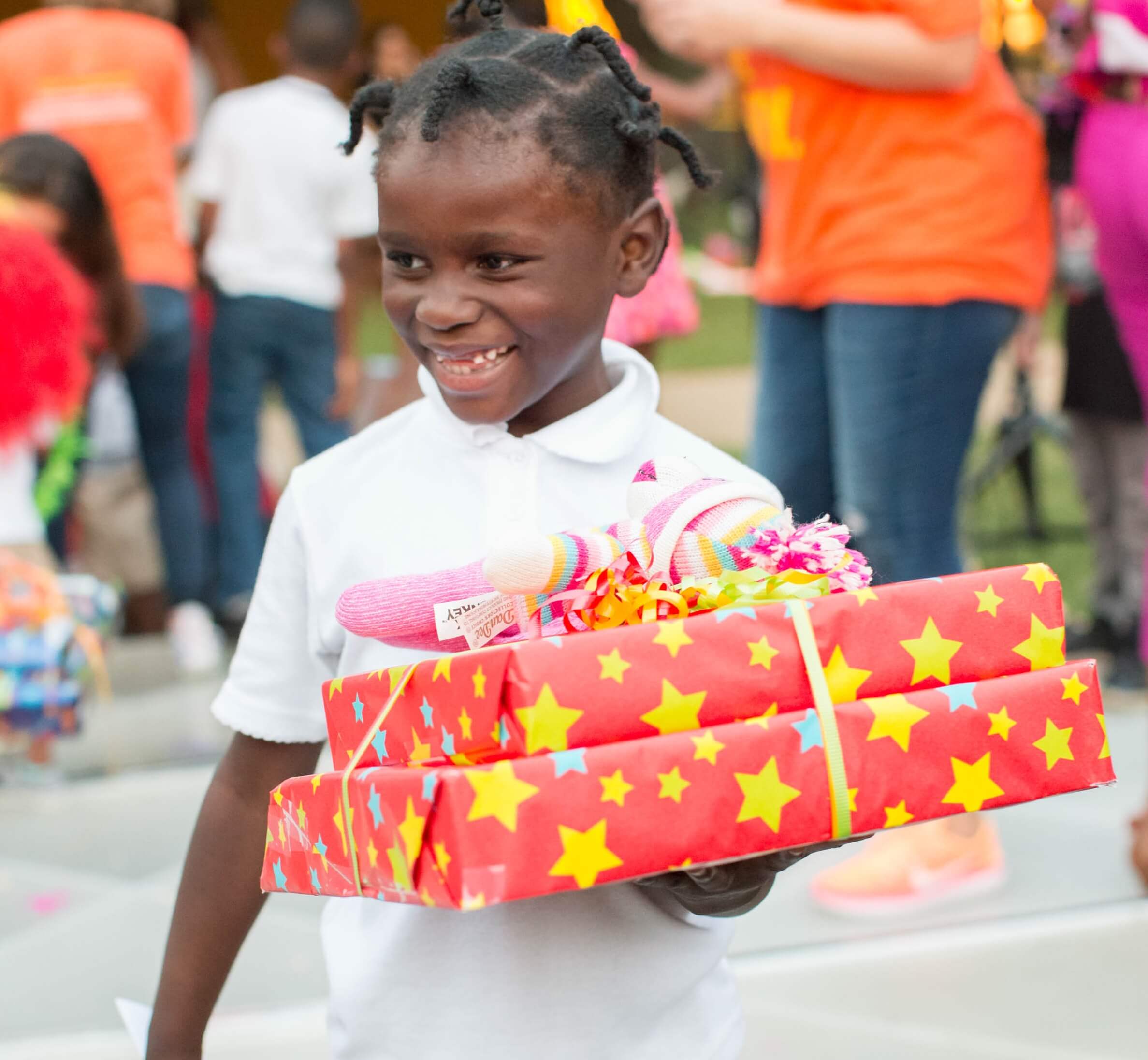 kid holding presents