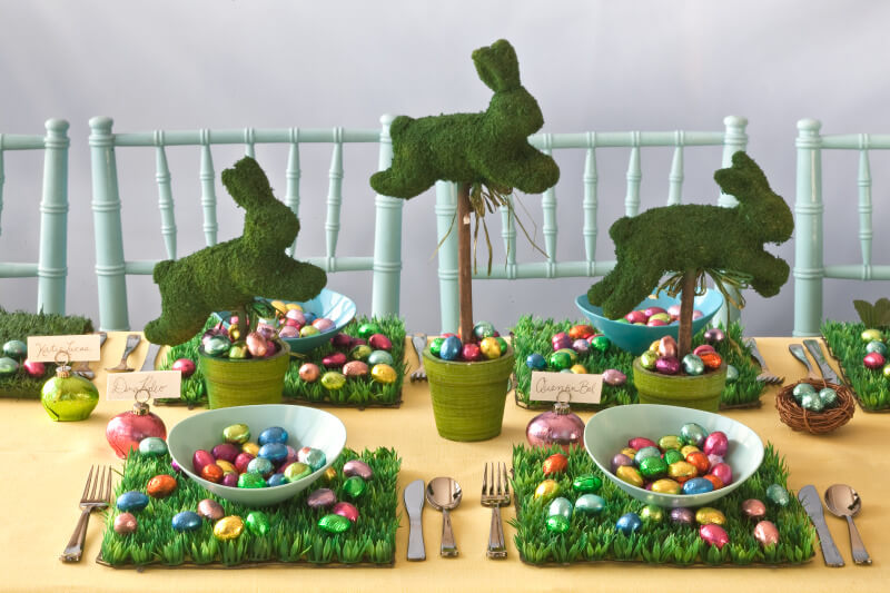 Easter lunch display of bunnies and candy and silverware and place settings