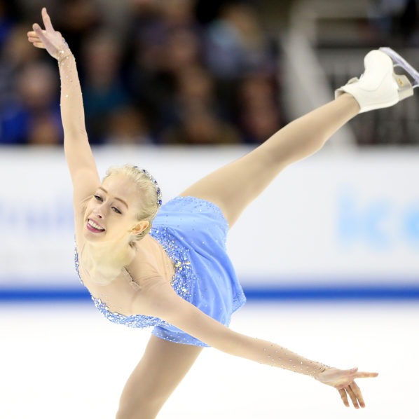 female ice skater in blue dress