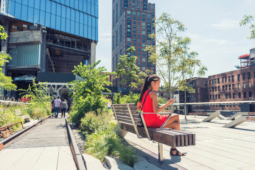 girl sitting on bench at highline