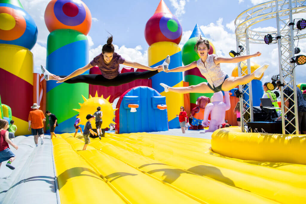 kids jumping in bounce house