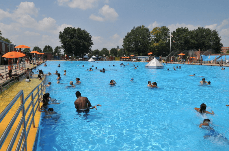 Children and parents swim at Red Hook Pool.
