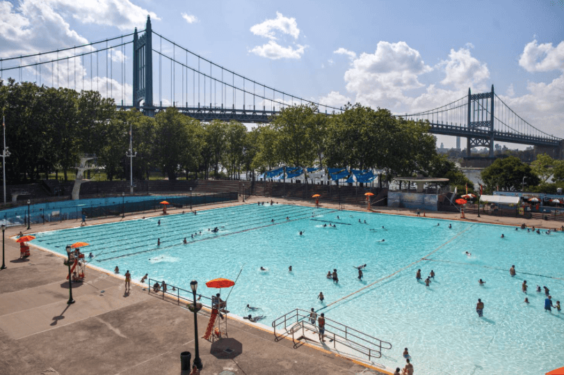 Families swim in Astoria Pool.