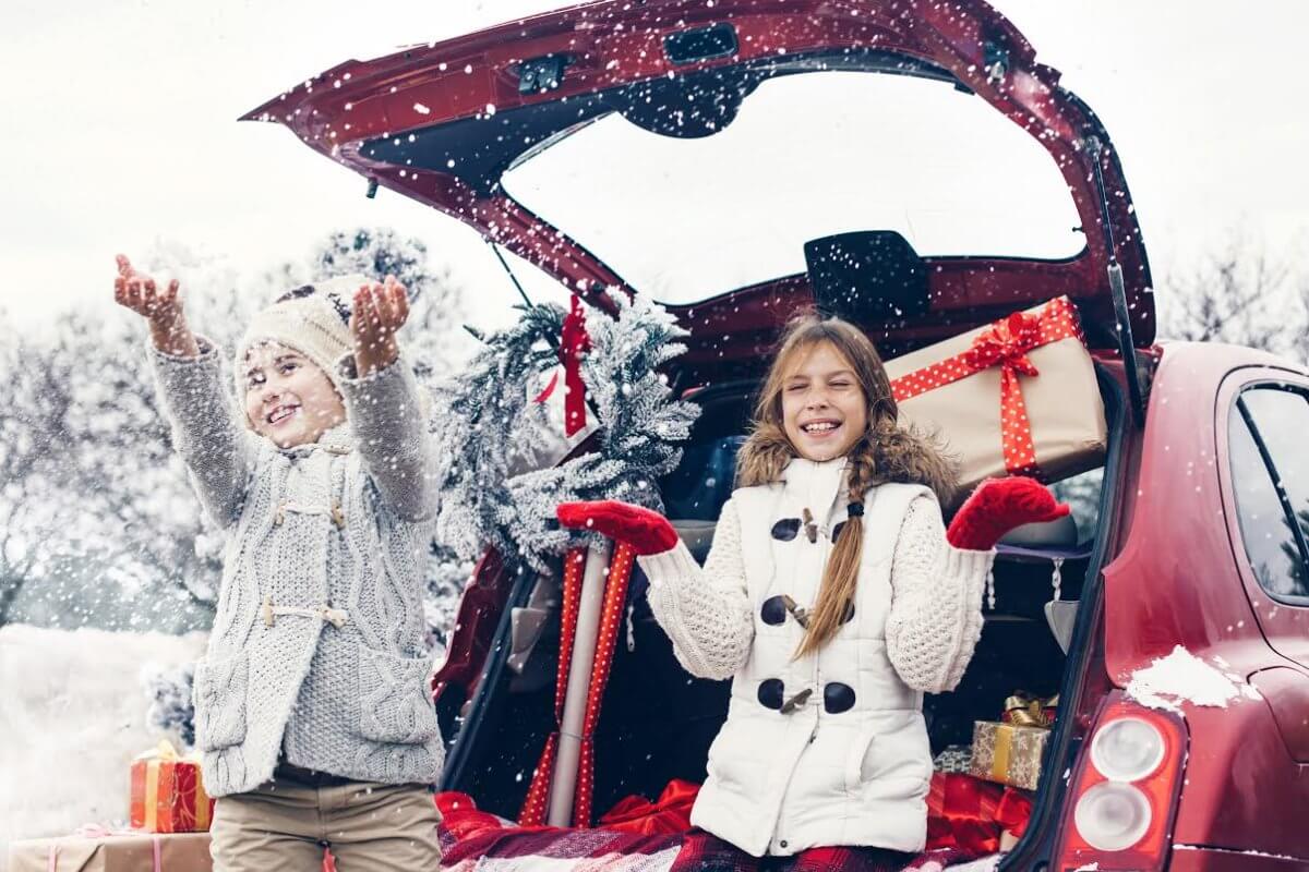 girls standing by the car while it's snowing best gifts for tweens teens