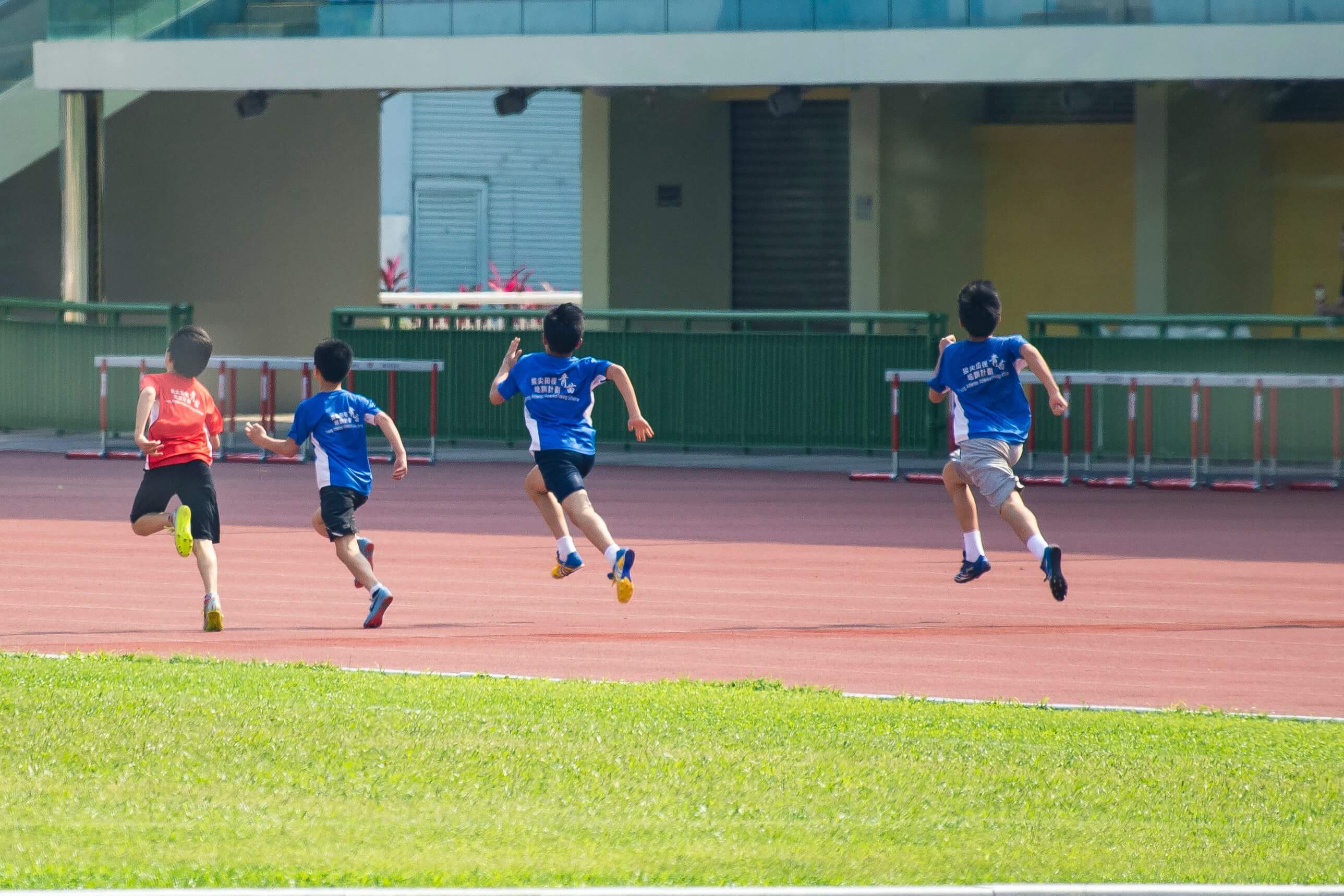 four-boys-running-in-track-2310482