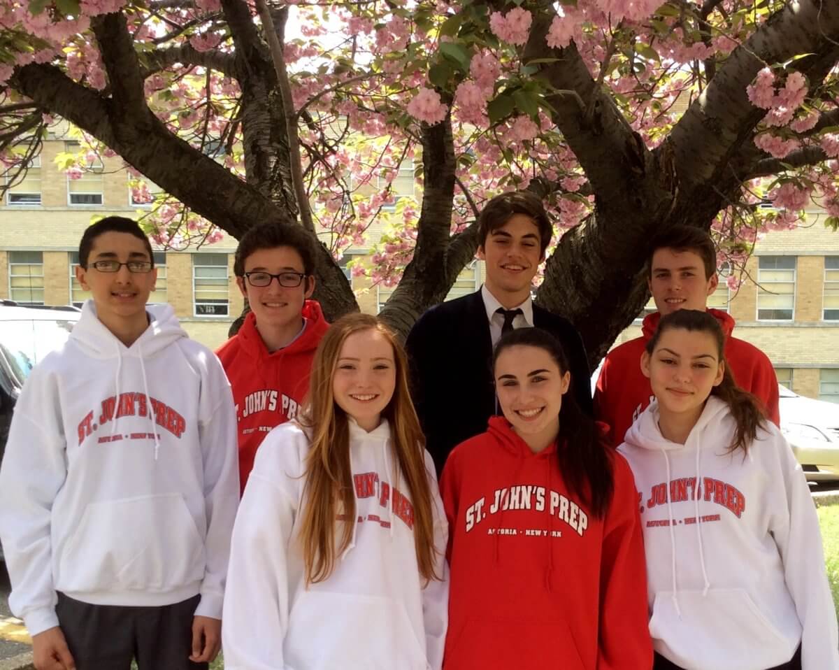 students wearing red and white hoodies