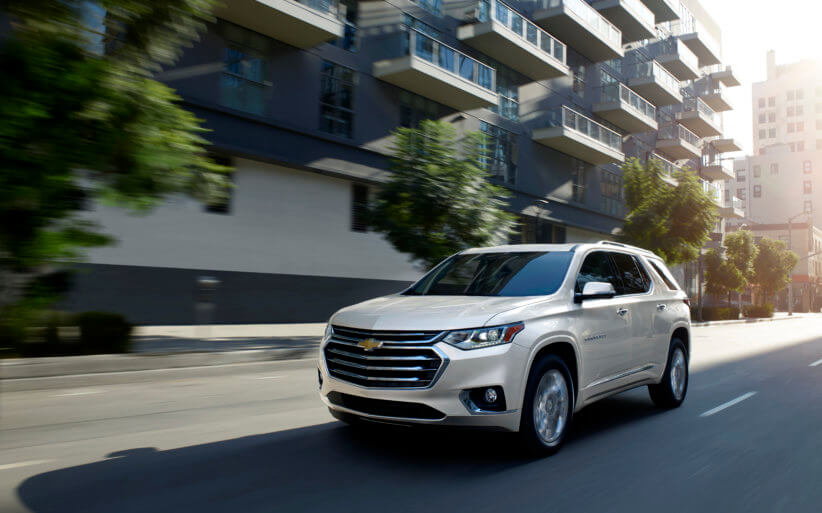 2020-Chevy-Traverse-High-Country-driving-down-a-city-street