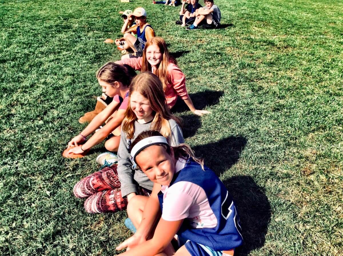 kids sitting on the grass sleepaway camp 101