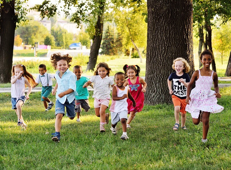 kids running on the grass