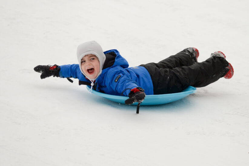 child playing the the snow