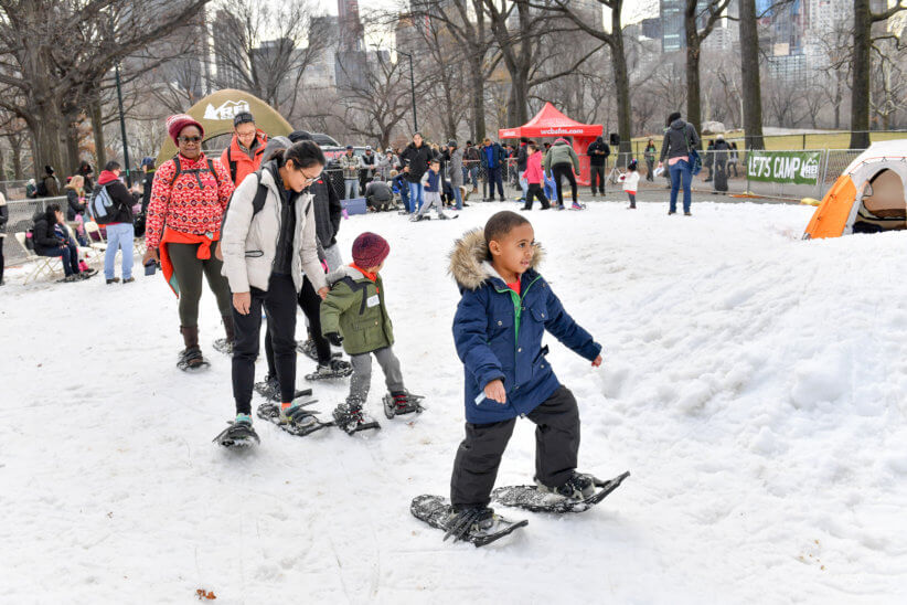 children learning how to ski in the snow at Winter Jam NYC