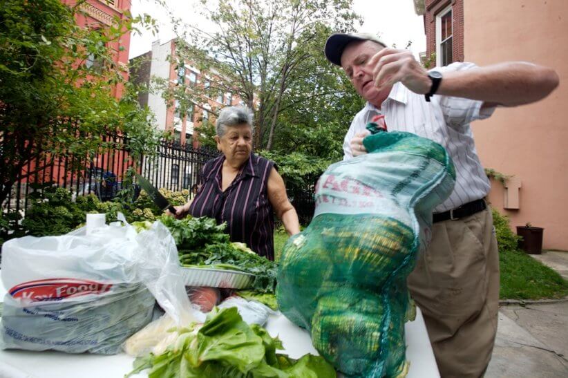 people volunteering and handling food