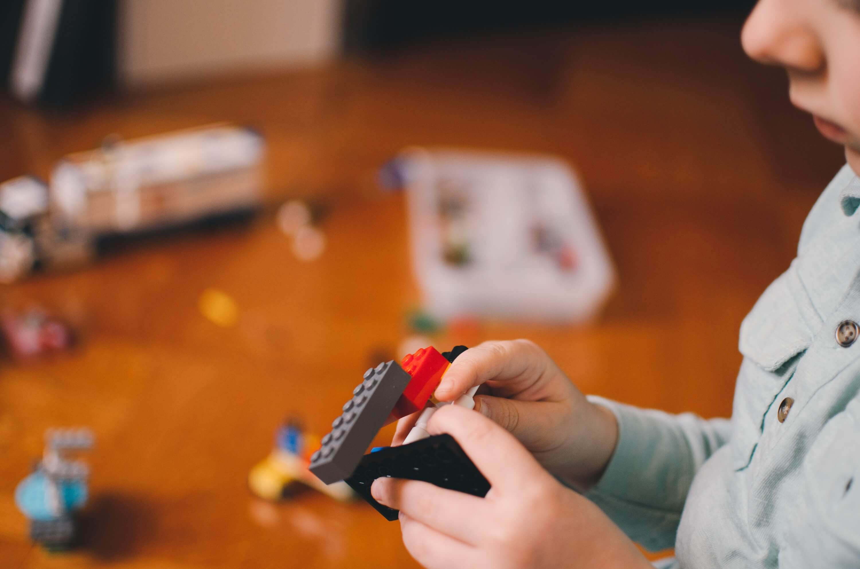 kid playing with Legos