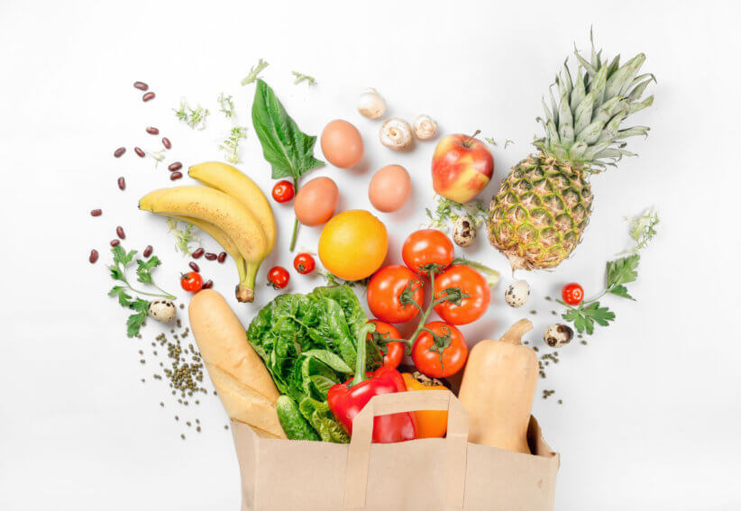 fruits and vegetables in a grocery bag