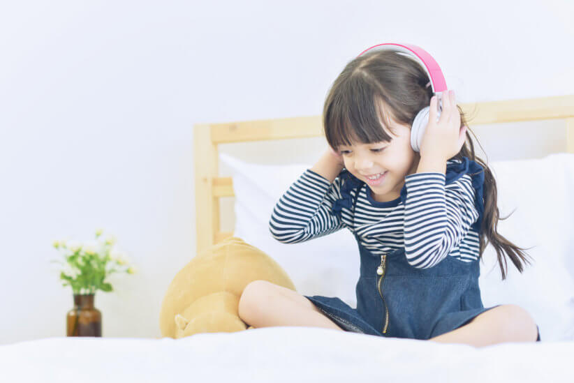 girl listening to kid podcast, Julie's Library