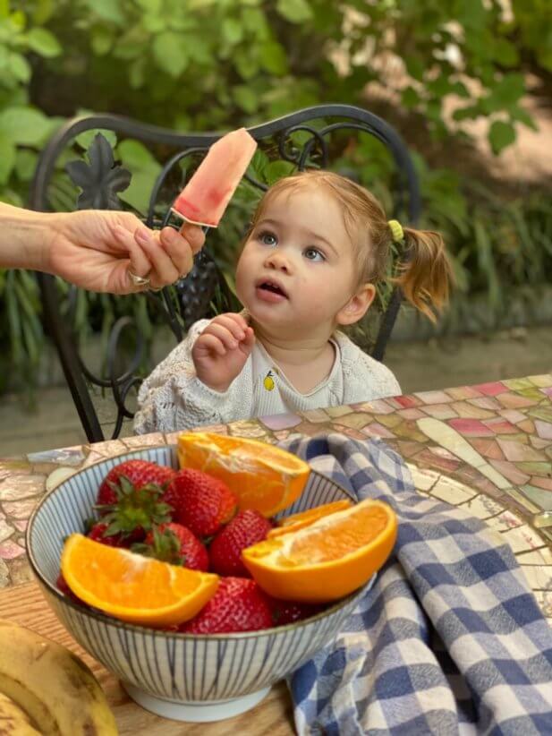 child looking at popsicle, summer lunches and snacks