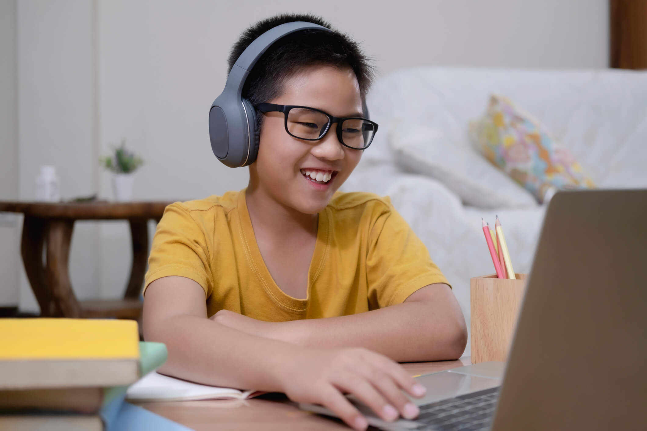 Asian boy enjoy self study with e-learning at home.