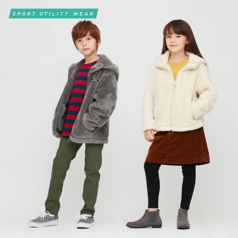 A boy and girl showing off fleecy jackets