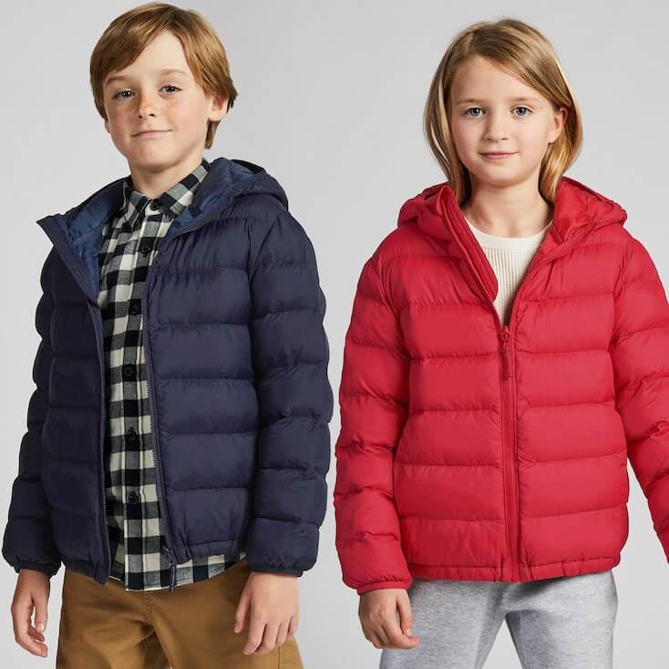 A boy and girl wearing puffy jackets