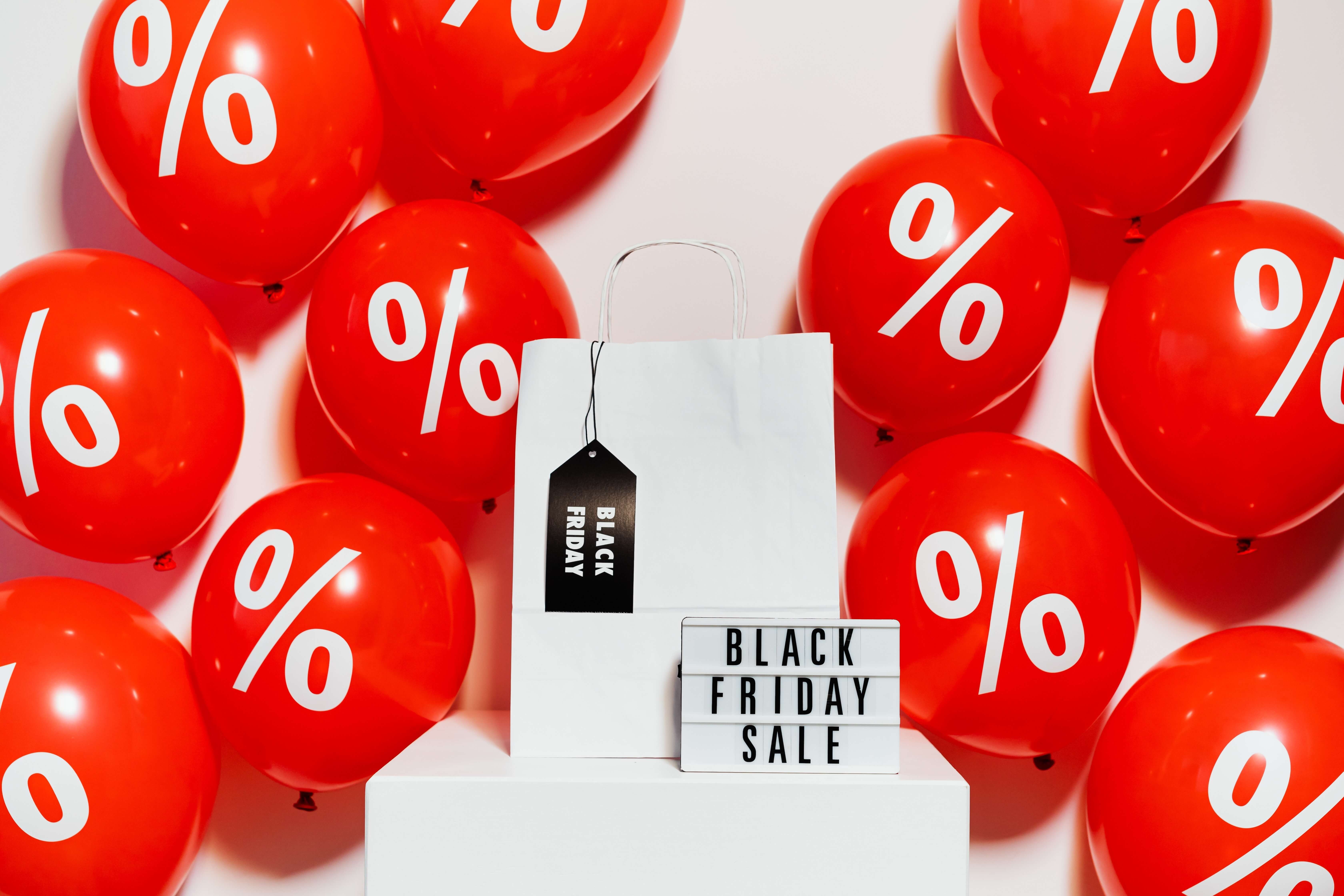 Black Friday Sign Amongst a Group of Red Balloonss