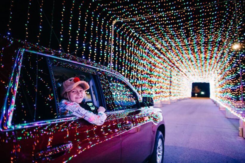 Girl looking at holiday lights 