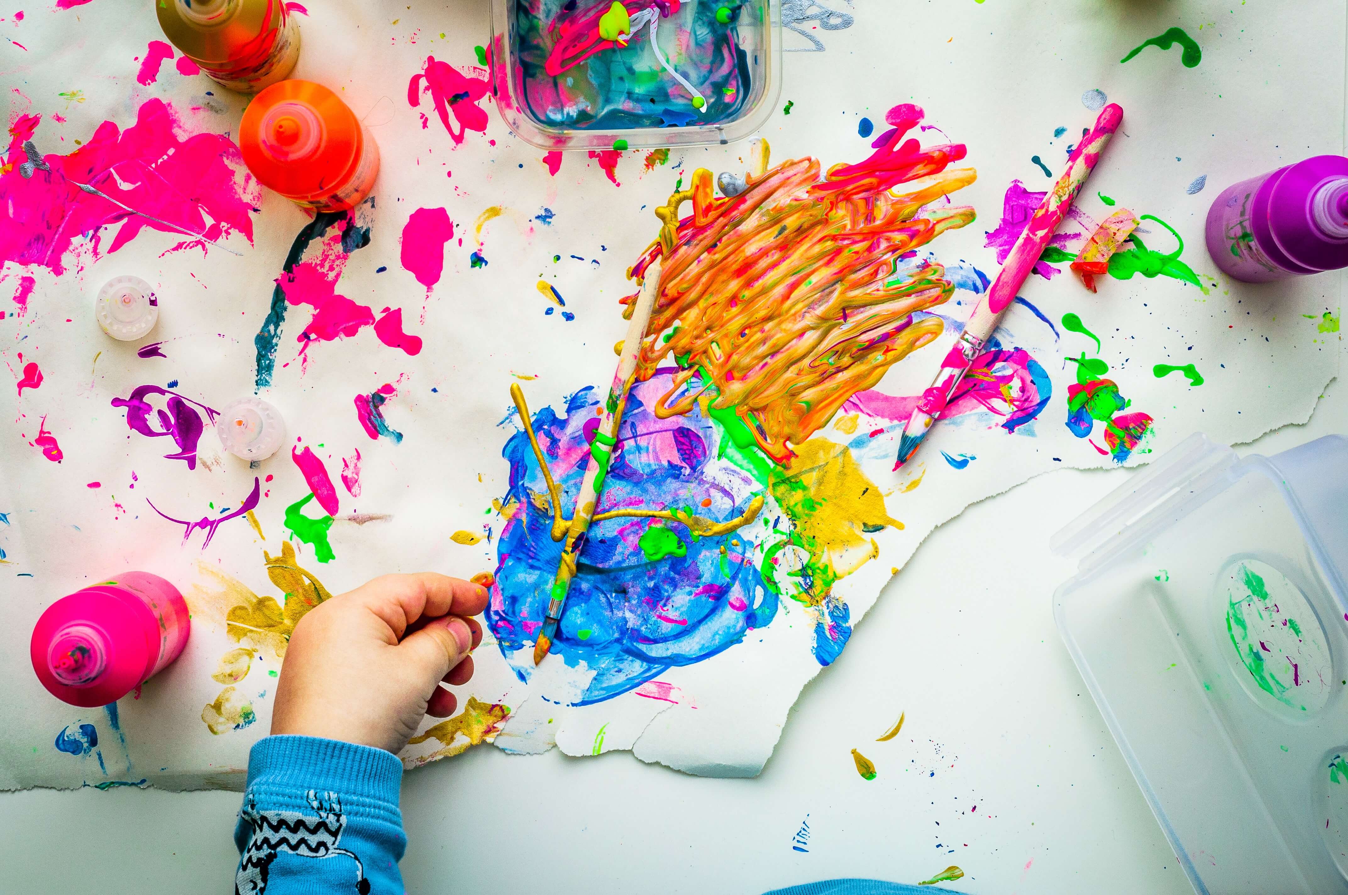 Kid holding a paintaing