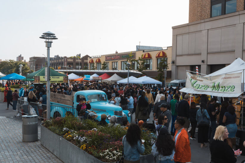 An overview photo of the Bronx Night Market reopening and bustling with people.