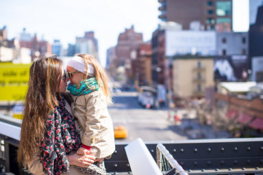 Adorable girl and mother enjoy sunny day in New York
