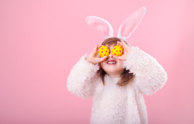 Portrait of a little girl with Bunny ears and Easter eggs