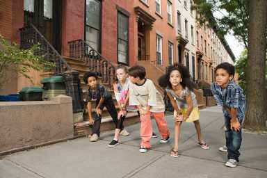 Kids about to race on sidewalk