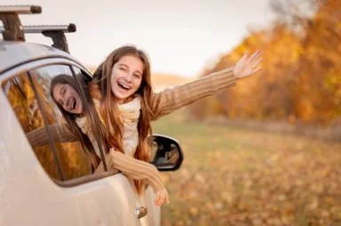 Girl peeking out car window