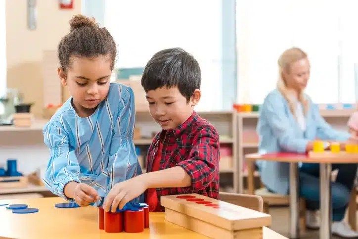 Kids playing an educational game in a montessori school