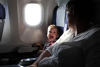 child crying on plane