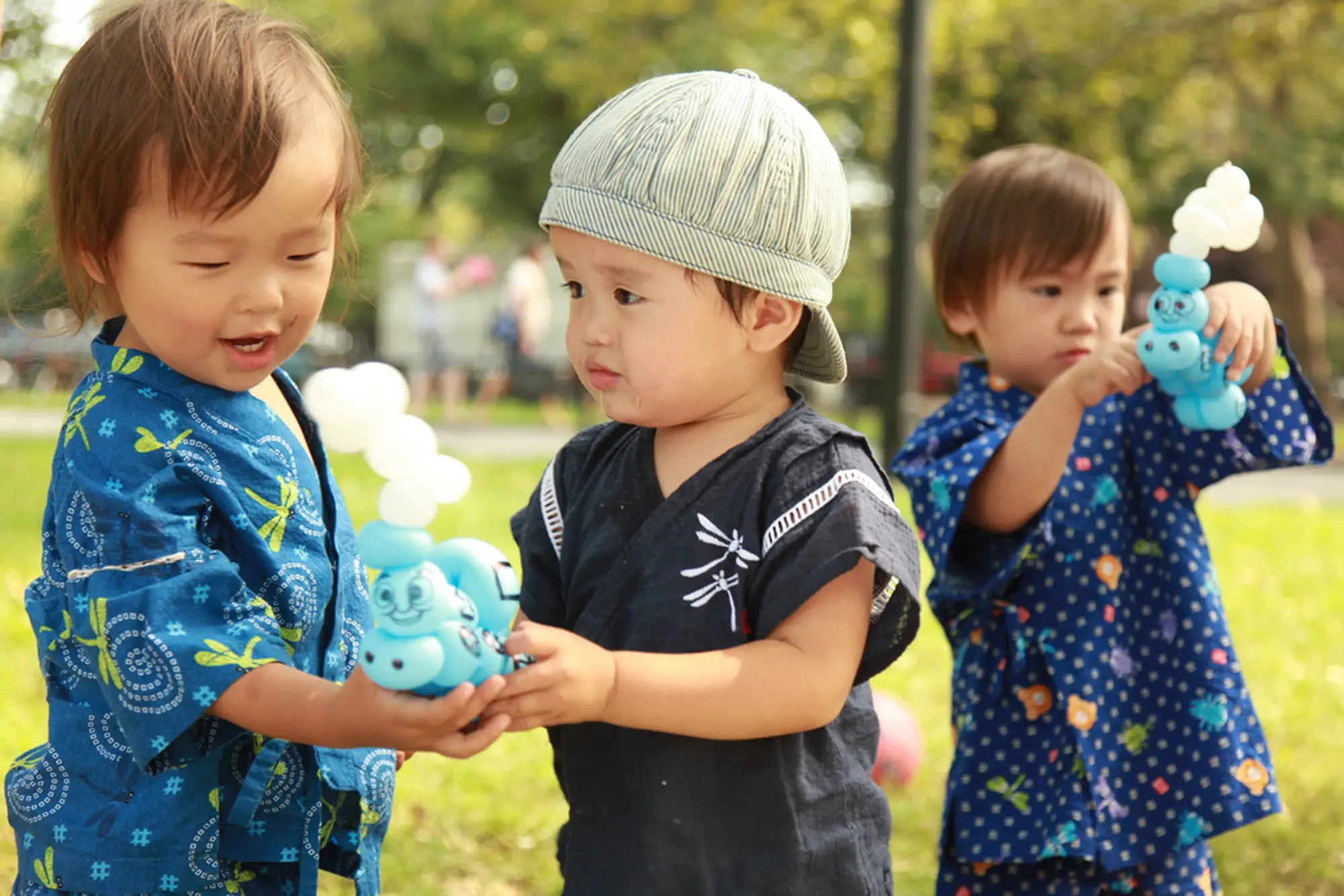 Two boys playing with Brooklyn Balloon Company creations