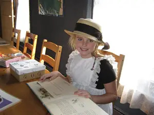 Bayside Historical Society children's room; little girl dressed in historical clothing