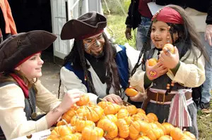 family dressed up as pirates for halloween; boo at the zoo, bronx zoo