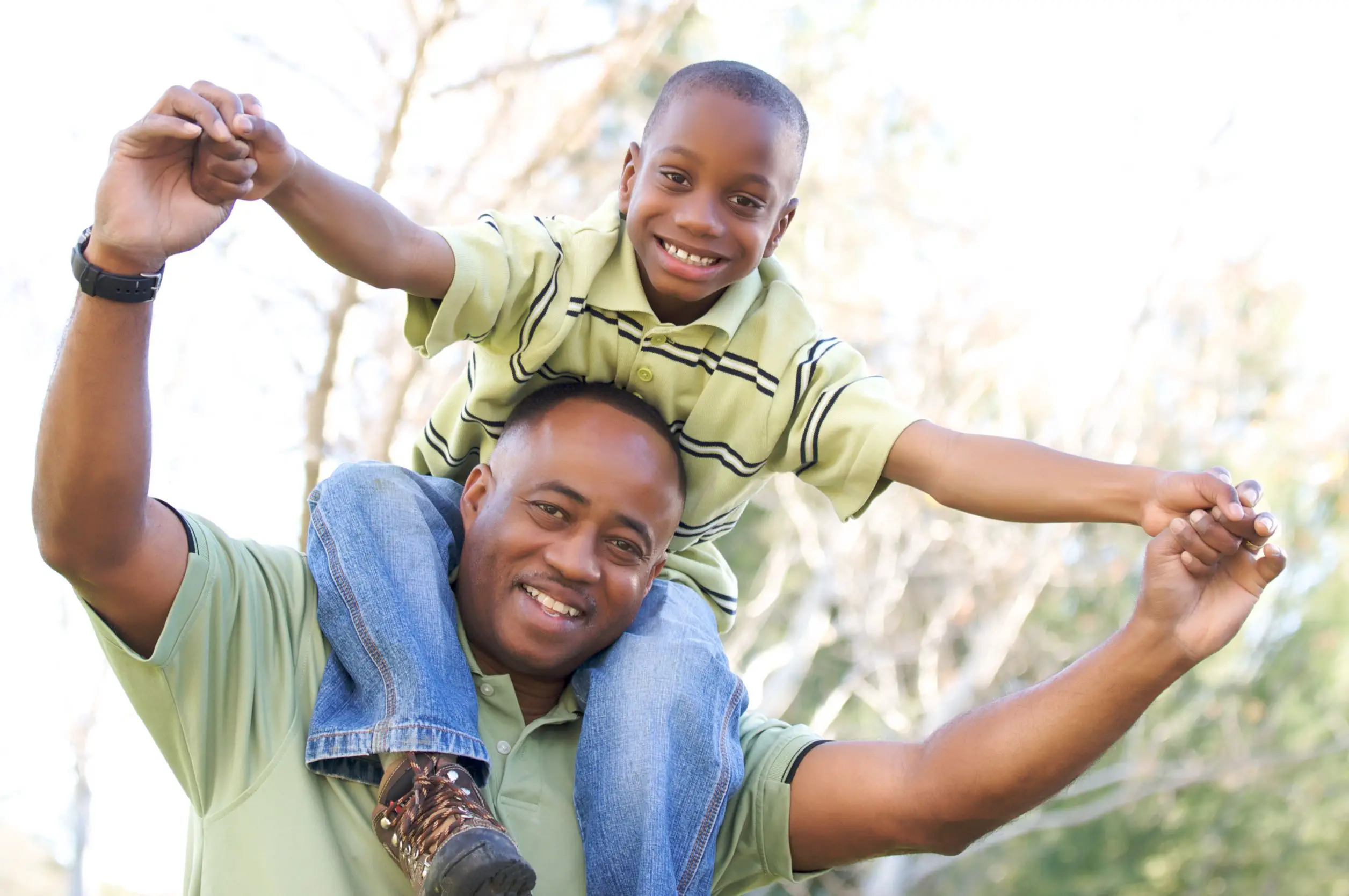 Father giving his son a piggyback.