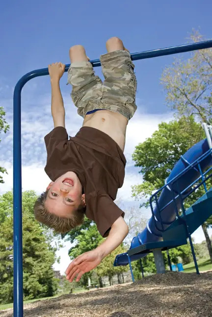 Boy on Monkey Bars