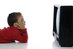 young boy watching tv 