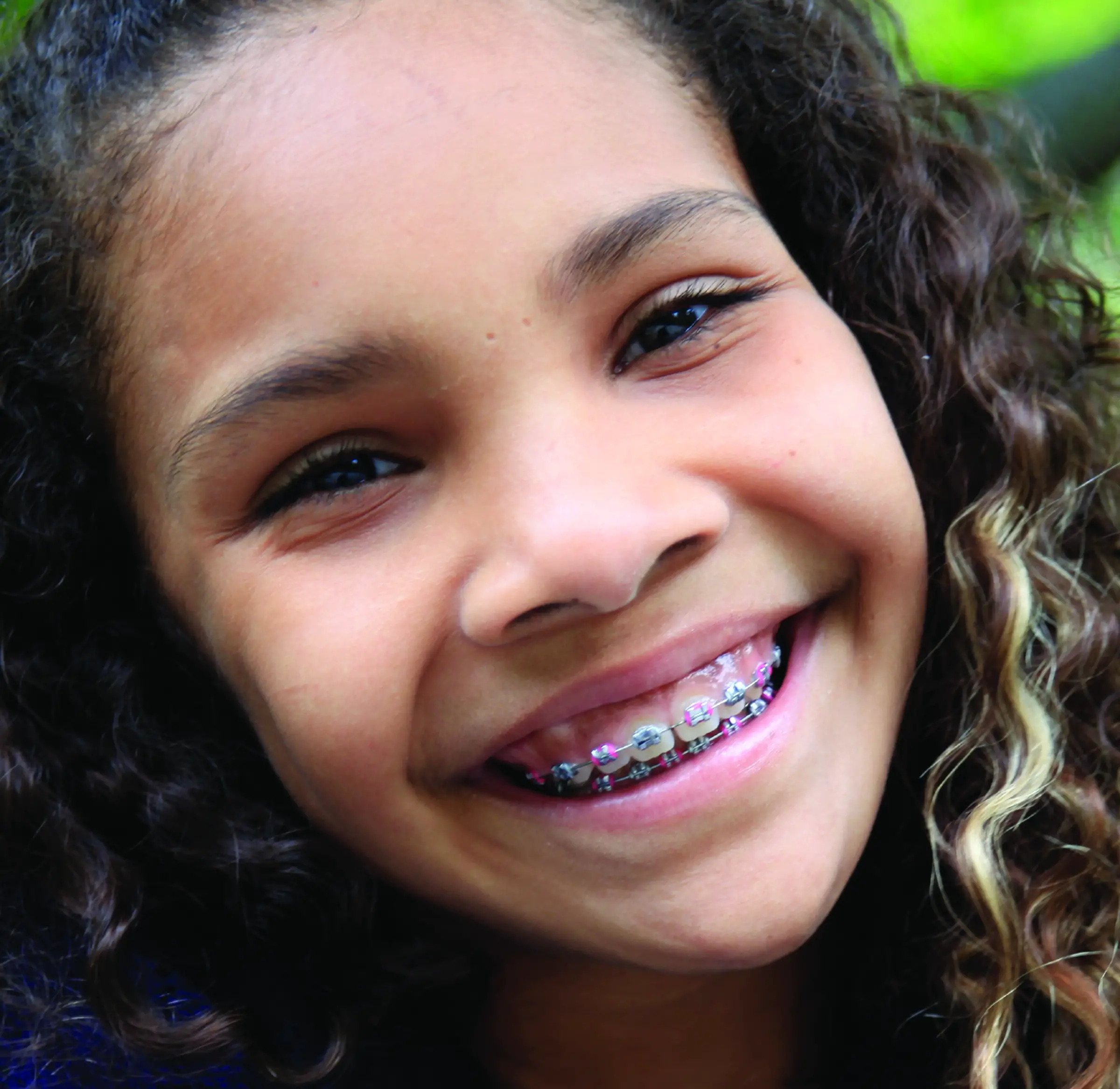 girl with braces smiling