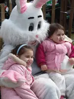 easter bunny with kids; kids sitting on easter bunny's lap