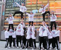 Cheerleaders of varying ages from Westchester's Gym City Lites performed in Times Square after marching in the NYC Veterans Day Parade this past November.