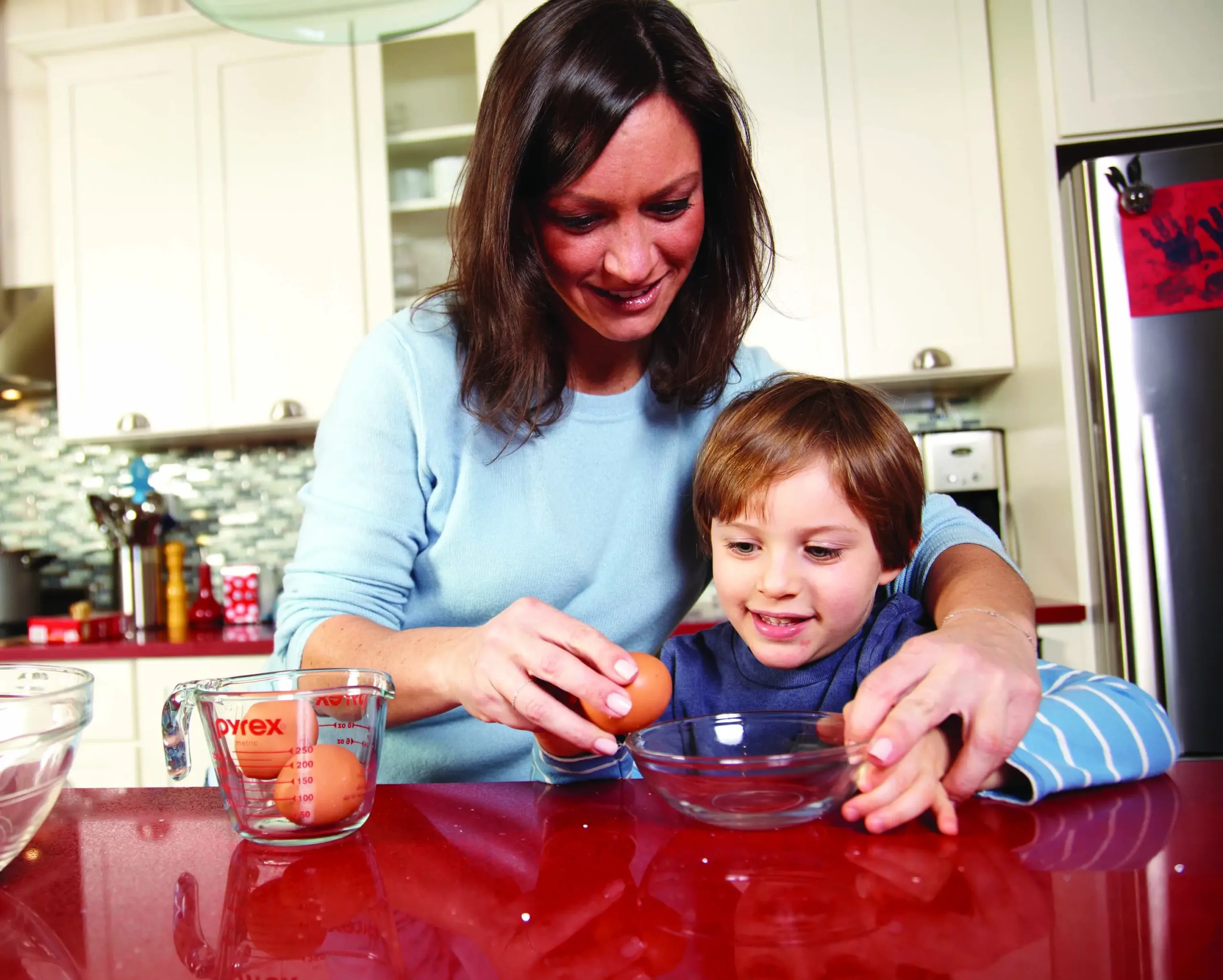 Cricket Azima and son Kingston cook together