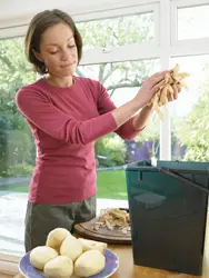 woman composting; compost