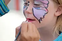 face painting; face painter; child getting face painted