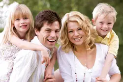 happy family in the summertime; family wearing all white