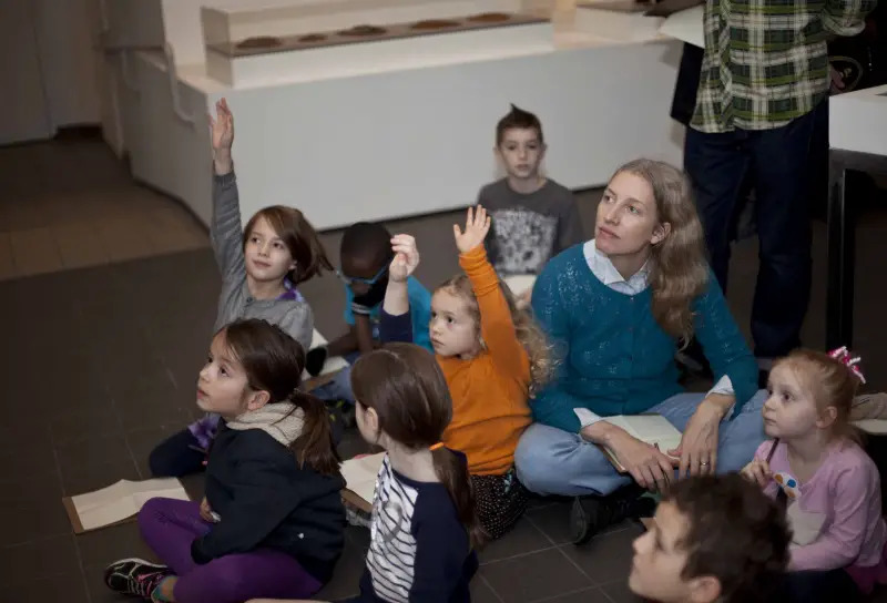 group of kids sitting on floor