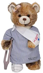 stuffed bear in hospital gown and arm sling